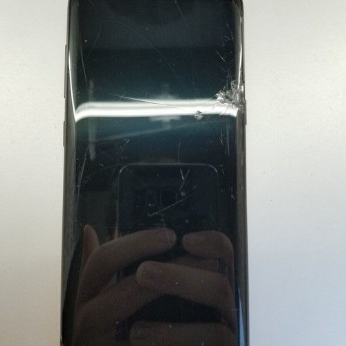 Samsung S8 smartphone with cracked screen and new battery