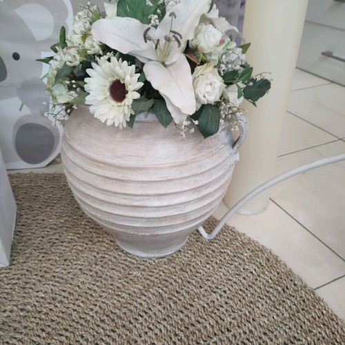 Pot with artificial flowers like new