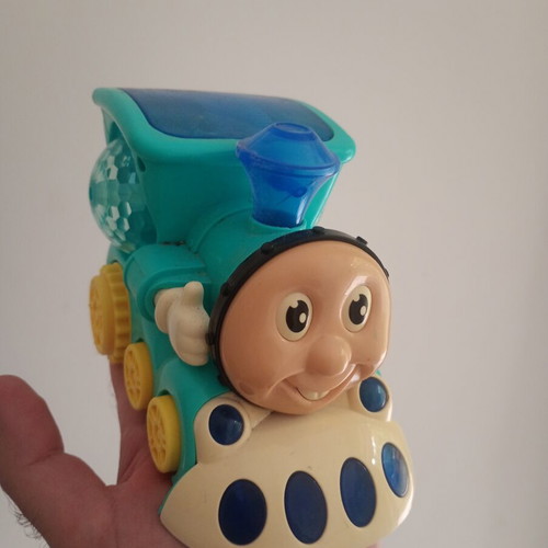 Cute Train toy with sounds, lights and movement, used