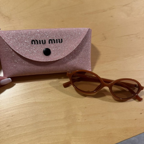 Miu Miu round orange sunglasses