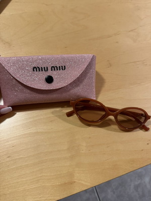 Miu Miu round orange sunglasses