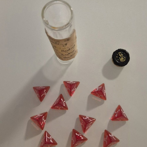 Dnd healing potion with 10 red tetrahedral dice in bottle