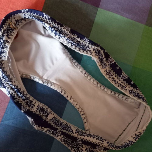 Sugarfree swim brief with white-blue ethnic pattern, size Large, plus free black swim brief