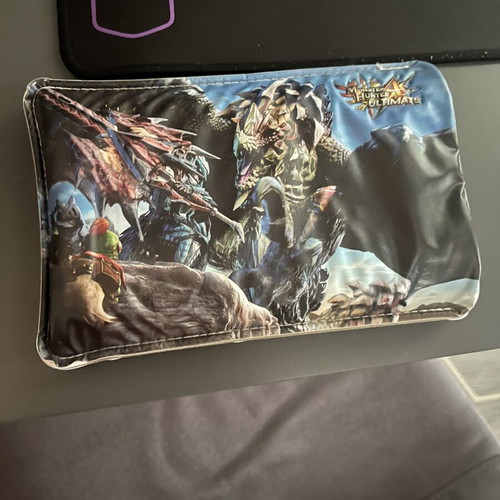 Nintendo 3DS New XL console with charger and Monster Hunters case