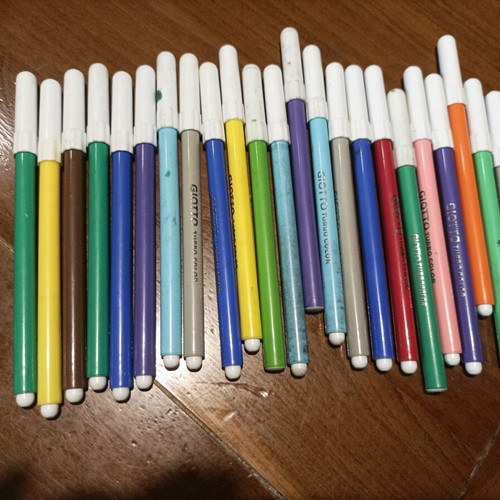 Various school supplies used with Giotto markers and pencil cases