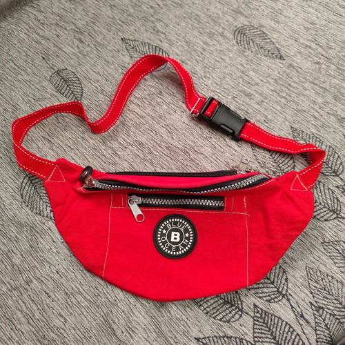 Red waist bag like new with 3 compartments