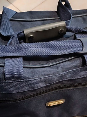 Blue travel sack used with 2 zippers and shoulder strap