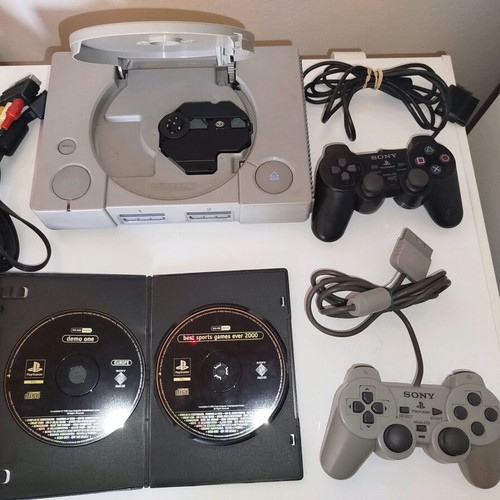 PlayStation 1 used with cables, two demos and two controllers