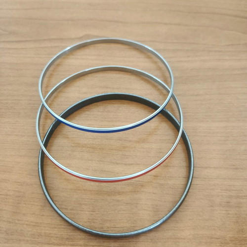 Stacking bangle bracelets used, 7 black metal and 2 colored