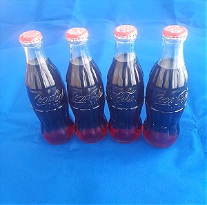 Coca-Cola 4 συλλεκτικά  μικρά μπουκαλια από 2004