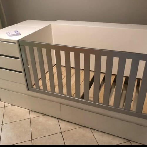 Cot that converts to bed with nightstand and desk used, with Greco strom mattress