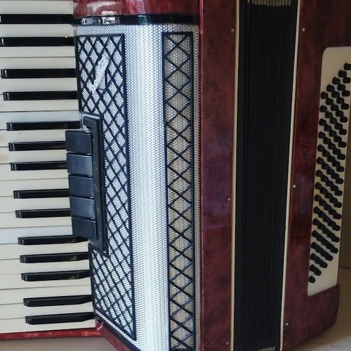 Vostok Accordion like new, red pearl vintage with case and books