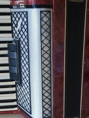 Vostok Accordion like new, red pearl vintage with case and books