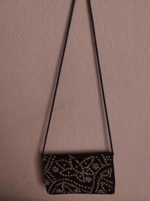 Black crossbody bag decorated with silver embroidery and beads