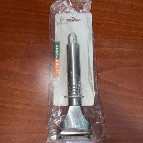 Spring stainless steel vegetable peeler