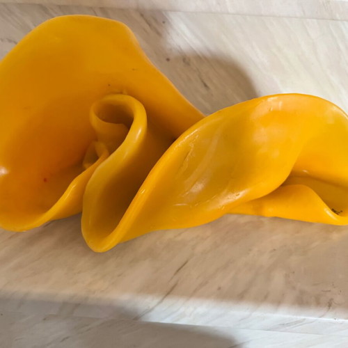 Handmade decorative candle with irregular shape, like new, yellow