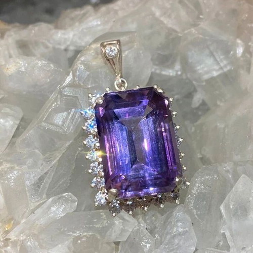 Silver pendant with large cut natural amethyst stone and moissanites