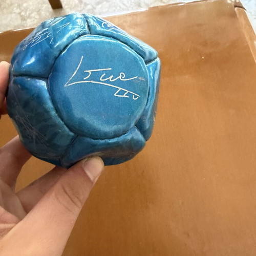 Decorative Barcelona ball with Messi, Xavi, Iniesta signatures