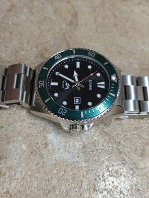 Casio Duro Marlin MDV-106B wristwatch used with green bezel and bracelet