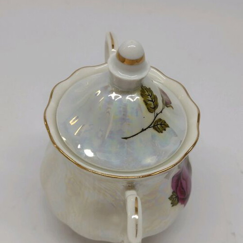Porcelain sugar bowl with roses and gold trim like new