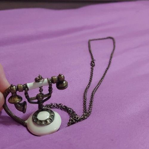 Necklace with phone pendant used