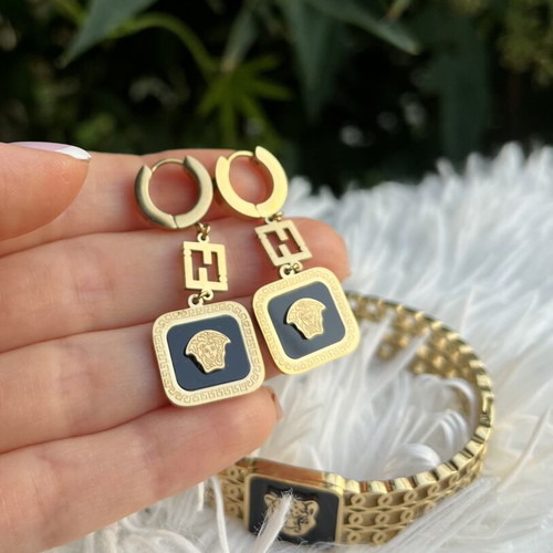 Princess stainless steel bracelet and earrings set like new, black and gold
