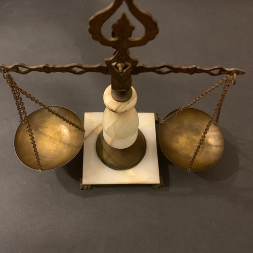 Decorative antique scale used with marble base and brass details