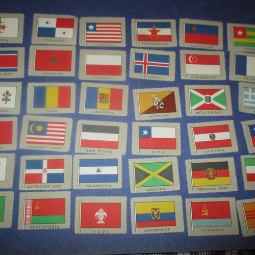 Lot of 36 used country flag stickers, 1960s collection