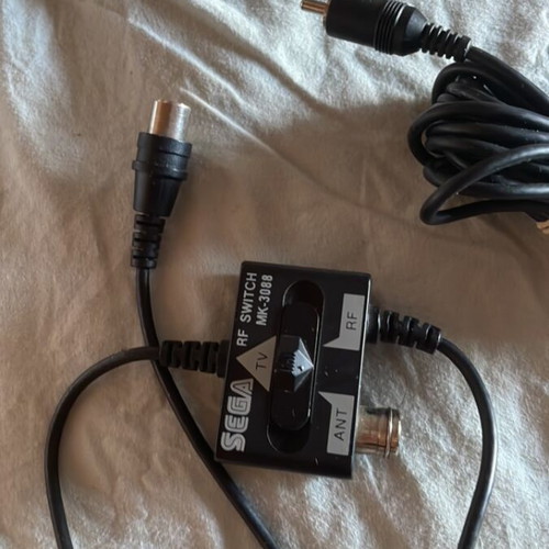 Sega Mega Drive NHL 96 game and RF tuner pack
