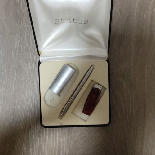 Gift set with lighters, pens, keychain, and calculator