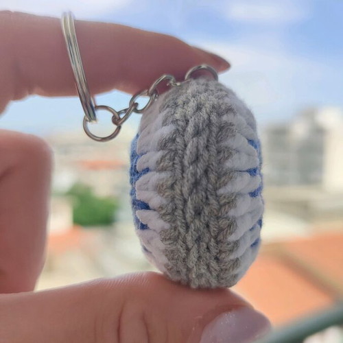 Knitted eye keychain new in gray color