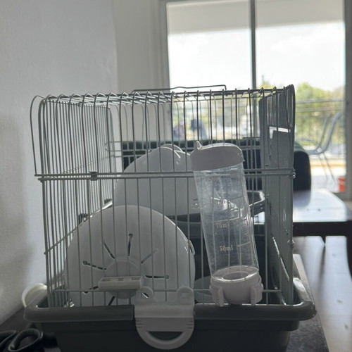 Hamster cage like new with accessories and woodchip substrate