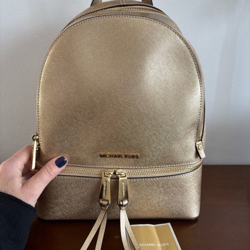 Michael Kors Rhea Medium backpack like new, gold