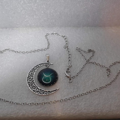Pendant necklace with Taurus zodiac and crescent moon, like new