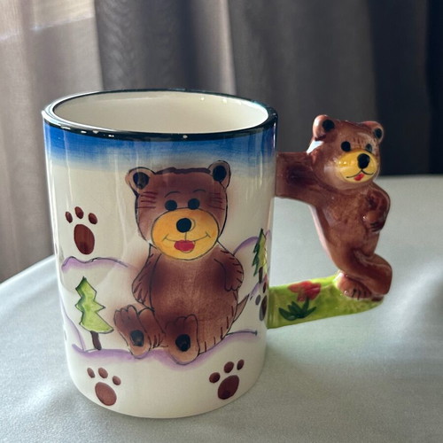 Vintage children's ceramic mug used with embossed designs