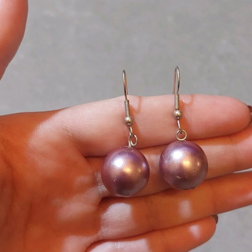 Dangling earrings used with purple and silver beads