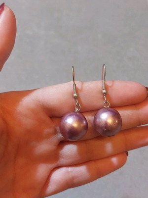 Dangling earrings used with purple and silver beads