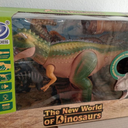 Dinosaur toy like new, in original box with minor wear