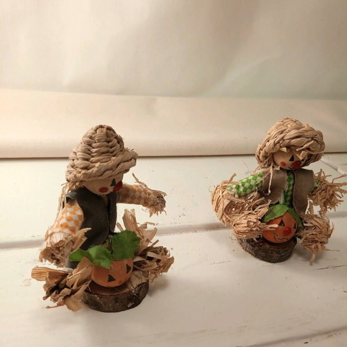Set of two scarecrow figurines with pumpkin made of natural materials like new