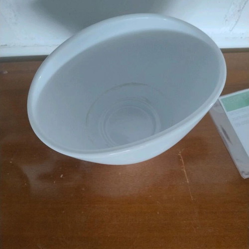 White flowerpot with unique opening