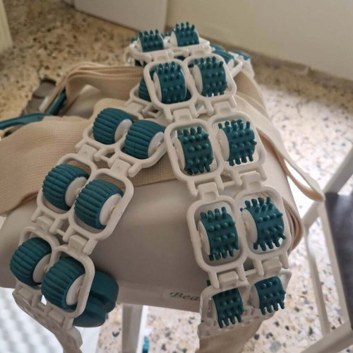 Massage and passive exercise device with rollers and straps like new