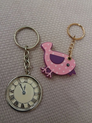 Vintage keychains set of 2, one clock with enamel and one bird mirror