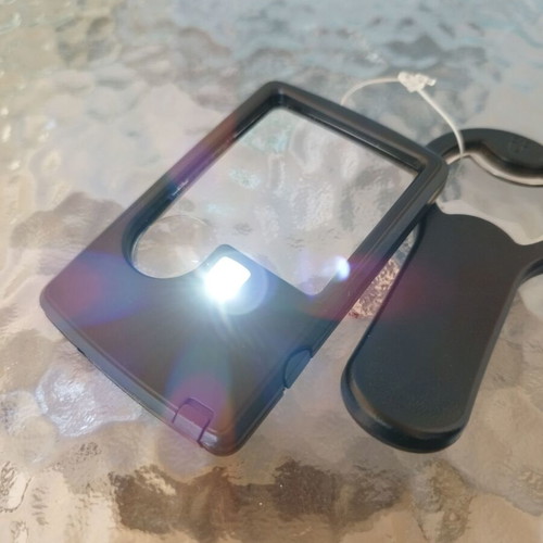 Magnifying glass with LED and opener new unused