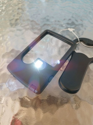 Magnifying glass with LED and opener new unused