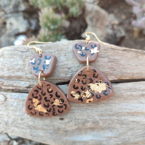 Clay earrings new with painted animal print and gold leaf accents