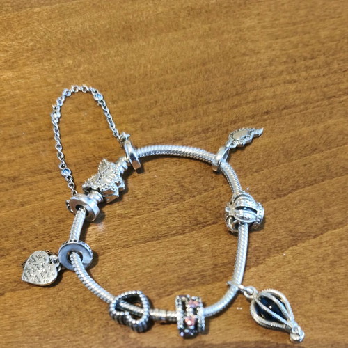 Pandora bracelet authentic used size 16 with 6 charms and safety chain