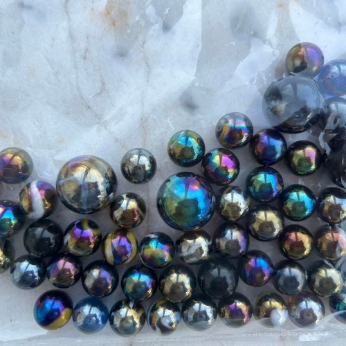 Marbles used, 52 small and 4 large dark-colored