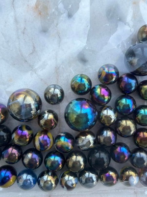 Marbles used, 52 small and 4 large dark-colored
