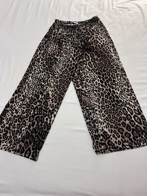 Leopard print palazzo pants with elastic waist and drawstring