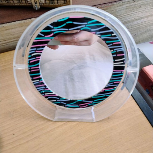 Makeup tabletop mirror with two sides used